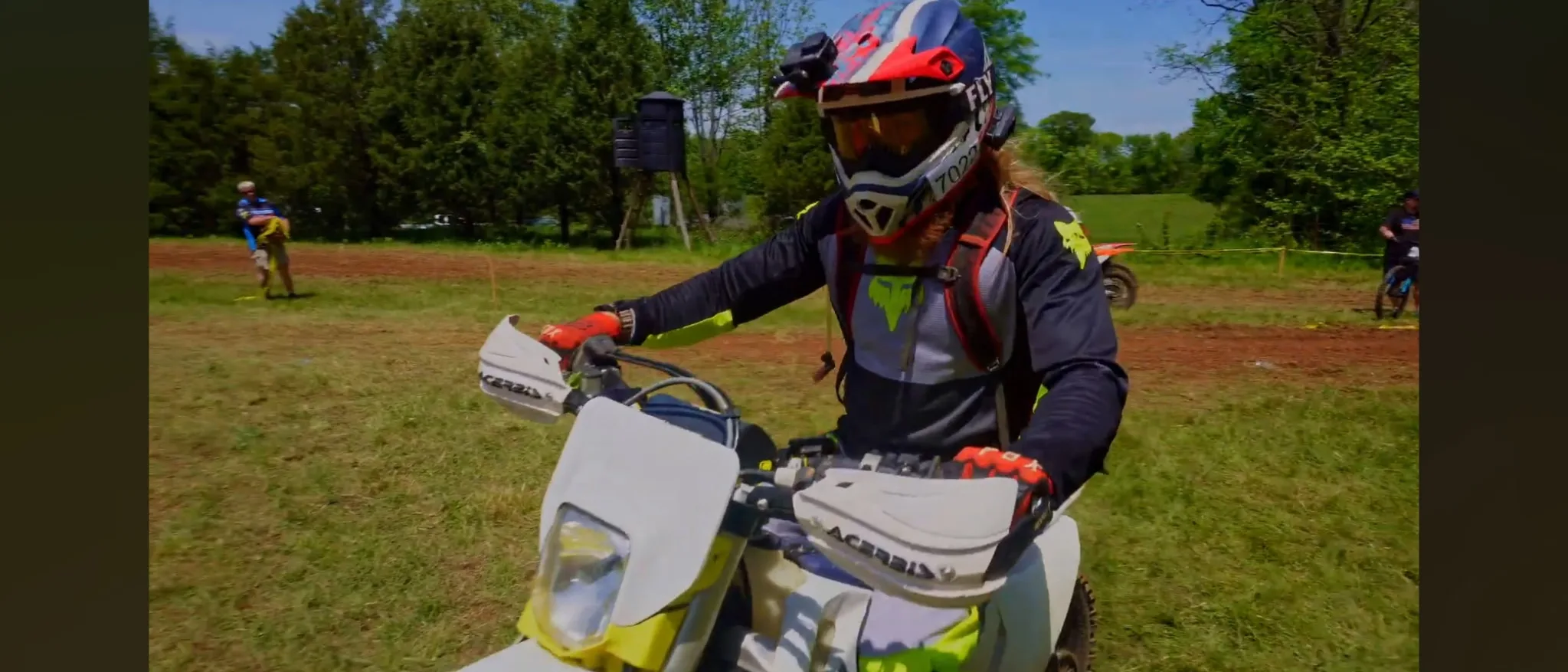 Cody Wood on a Husqvarna dirt bike in full gear at a hare-scramble event