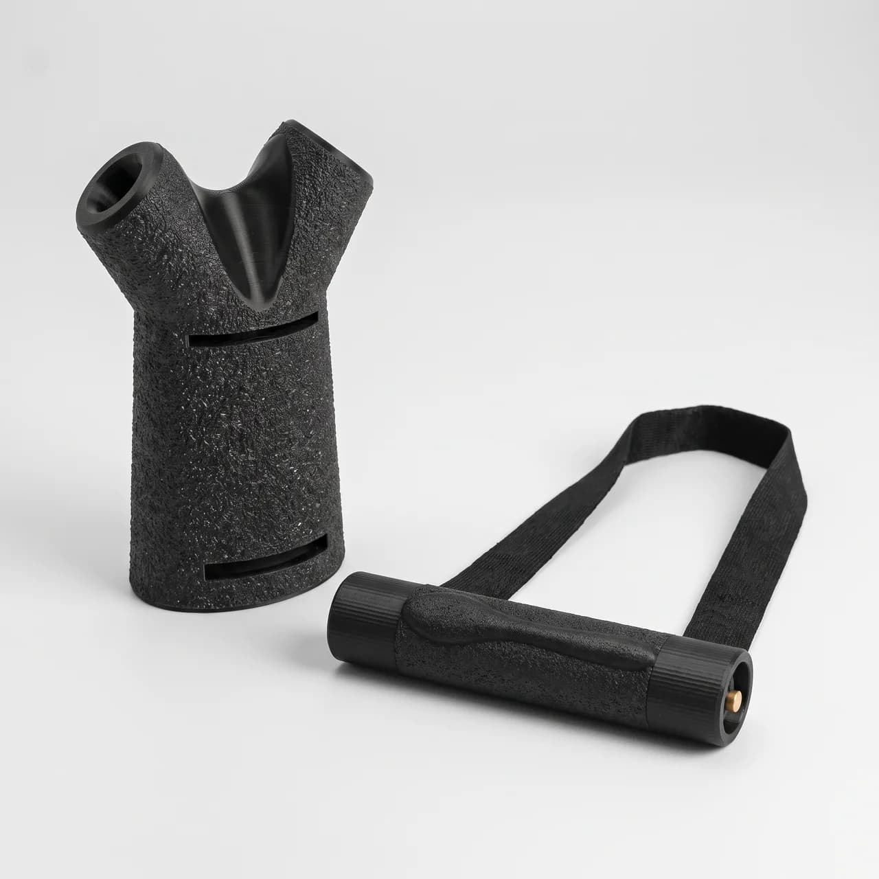 Toproll Pack: Pronatinator and Finger Wrench armwrestling training handles in black, studio view