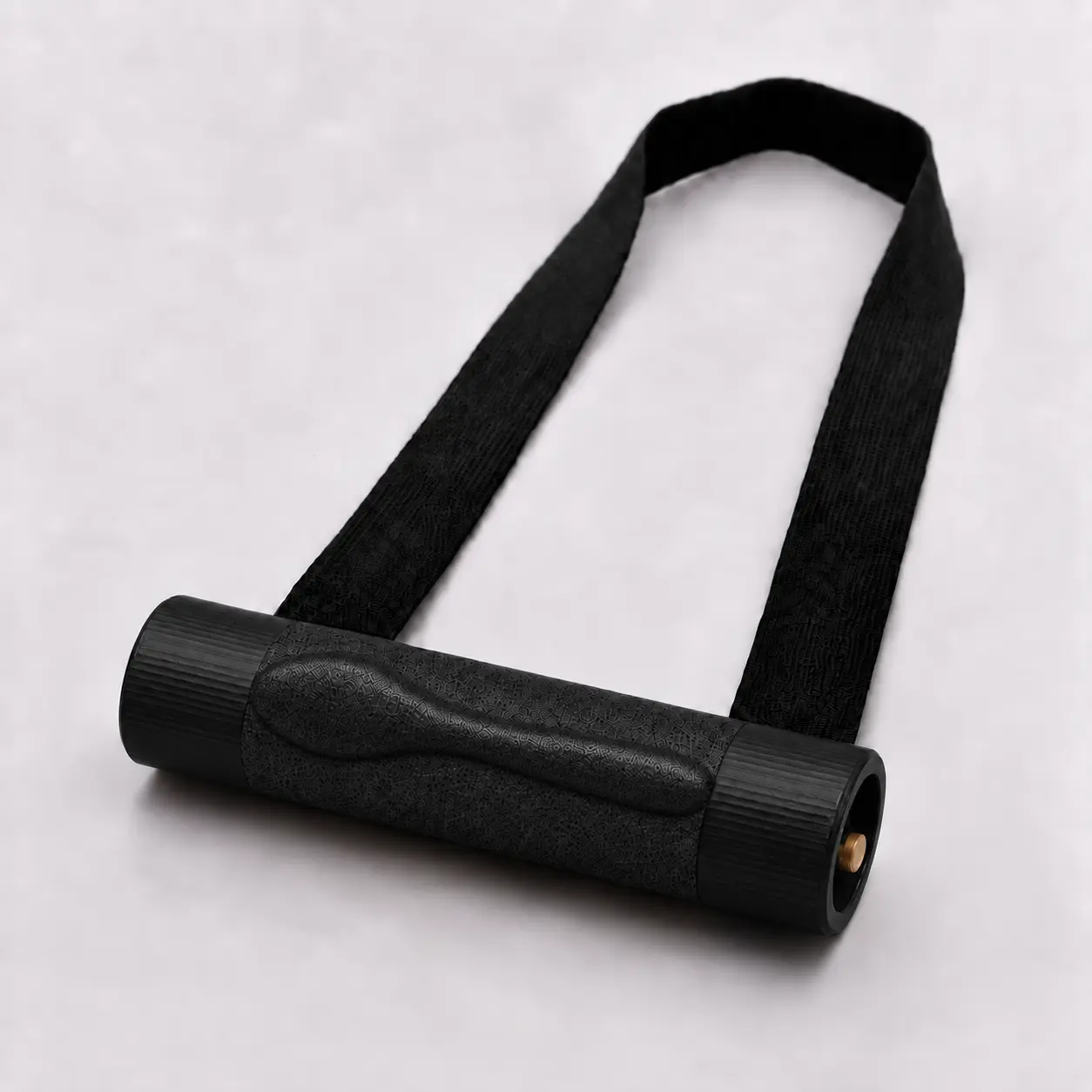 Finger Wrench training handle in black with textured grip roller and black strap, angled studio view