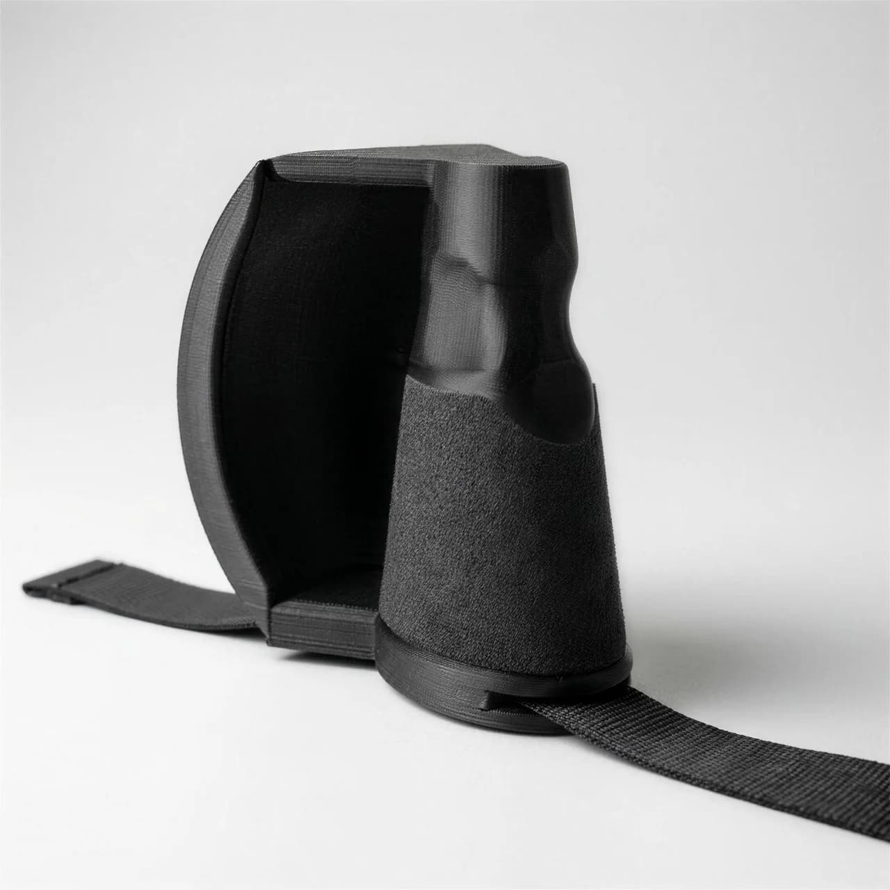 Ulnar Max training handle — ellipse grip inside its curved guard